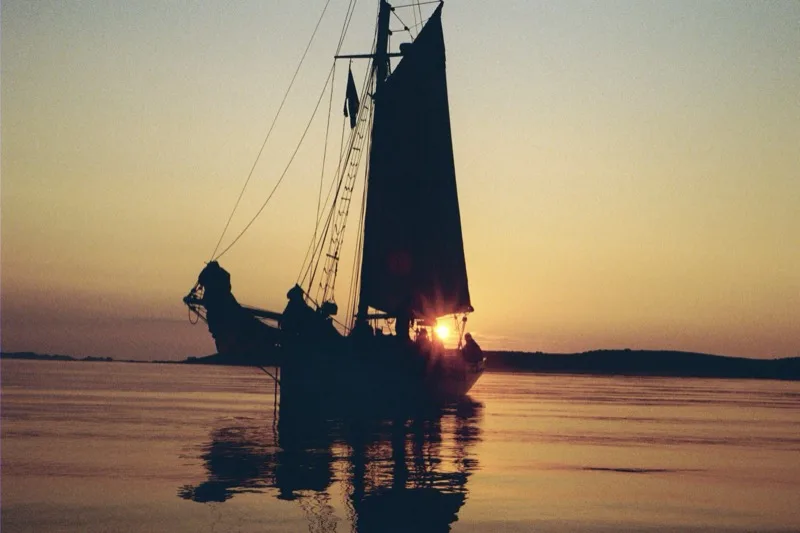 Sailboat at sunset off the Maine coast